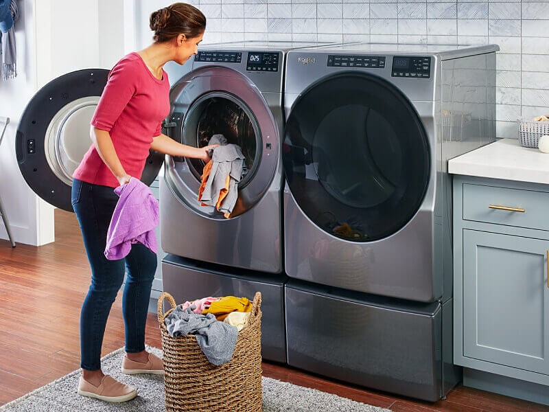Happy customer using laundry machine